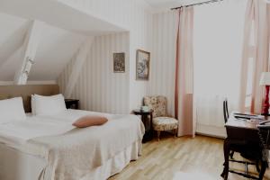 Postel nebo postele na pokoji v ubytování Blommenhof Hotel