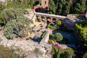 an aerial view of a house and a bridge at Soho Boutique Castillo de Santa Catalina - Adults Recommended in Málaga