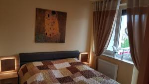 Posteľ alebo postele v izbe v ubytovaní Zafír Sziget Apartman