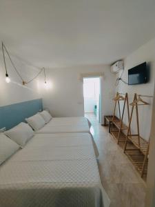 Ένα ή περισσότερα κρεβάτια σε δωμάτιο στο H El Palmeral Playa