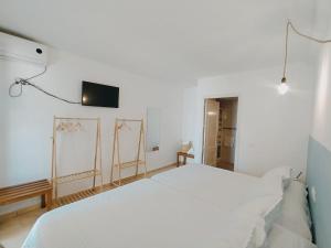 Postel nebo postele na pokoji v ubytování H El Palmeral Playa
