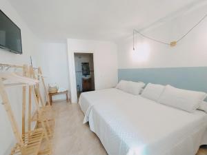 Postel nebo postele na pokoji v ubytování H El Palmeral Playa