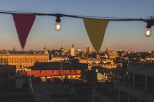 a view of a city with buildings and lights at Hobo Hotel Stockholm in Stockholm