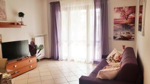 TV a/nebo společenská místnost v ubytování In Vacanza da Miki 03