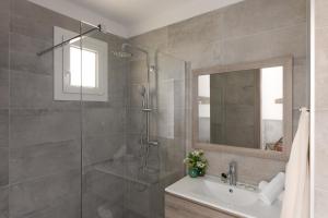 a bathroom with a tub, sink and mirror at Hôtel-Restaurant Marina Di Lava - Grand Ajaccio in Appietto