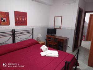 Postel nebo postele na pokoji v ubytování Hotel Alloggio Del Conte