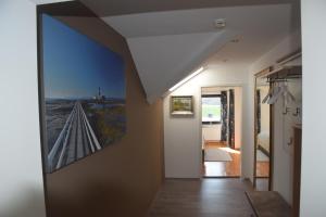 a hallway with a painting of a bridge on the wall at Fewo Landweg in Limburg an der Lahn
