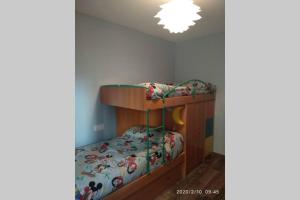 A bed or beds in a room at Apartamento Casa Barquero Bronchales