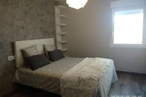 A bed or beds in a room at Apartamento Casa Barquero Bronchales
