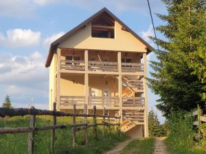 a house that is being built in a field at Apartment Durmitor in Žabljak