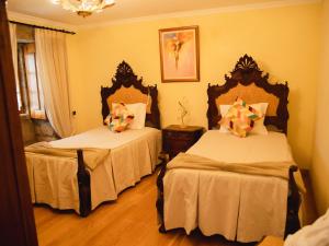 Ένα ή περισσότερα κρεβάτια σε δωμάτιο στο Casa da Igreja +22 φωτογραφίες