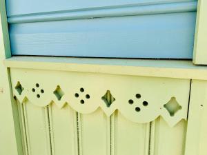 a wooden dresser with a blue top with holes in it at Boutique Villa MAMELFA in Tiheda