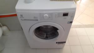 a white washing machine sitting in a bathroom at Stella Marina Bed and Breakfast sul mare in Realmonte