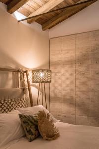 a bedroom with a bed with a wooden wall at Rizes Sea View in Nisakion