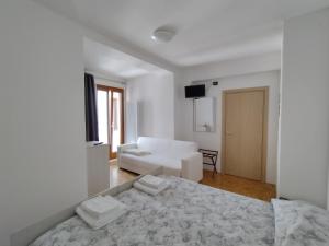 Postel nebo postele na pokoji v ubytování Hotel Da Marco