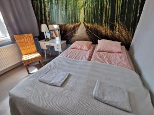 a bedroom with a bed with two pillows on it at Captivating 4-Bed Apartment in Kotka SaunaFacility in Kotka