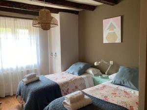 A bed or beds in a room at Caserío Sautu Goikoa