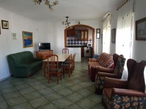 a living room with a table and chairs at MATALASCAÑAS-SOL 4 Dormitorios in Matalascañas
