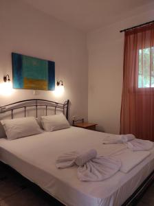 Ένα ή περισσότερα κρεβάτια σε δωμάτιο στο Chrouso Apartments