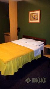 Letto o letti in una camera di Hostal Residencial Mochica
