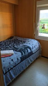 Katil atau katil-katil dalam bilik di Bjarnastaðir Guesthouse