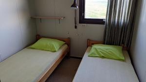 Katil atau katil-katil dalam bilik di Bjarnastaðir Guesthouse