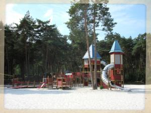 a playground in a park with a slide at Rent & Relax in Mol