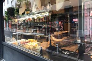 a display window of a store with food in it at La petite oasis, newly renovated in Toulon