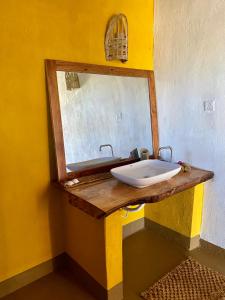 a bathroom with a sink and a mirror at Eden Rock Zanzibar in Mtende