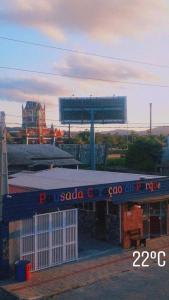 a building with a sign on the top of it at Pousada Coração do Parque in Penha