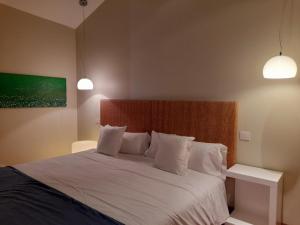 Postel nebo postele na pokoji v ubytování Hotel Ceres