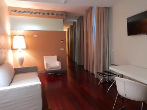 Postel nebo postele na pokoji v ubytování Hotel Ceres