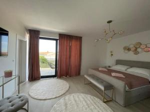a bedroom with a bed and a large window at Villa Eureka in Vodice +35 photos