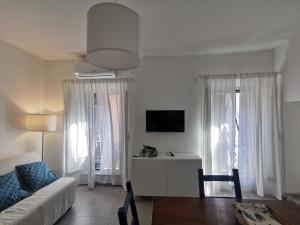 a living room with a couch and a table at Domus Taura in Terracina