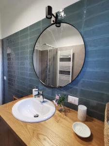 a bathroom with a sink and a mirror at Domus Taura in Terracina +15 photos