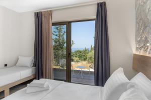 Gulta vai gultas numurā naktsmītnē Sigma Luxury Rooms