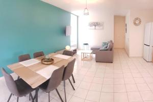 a kitchen and dining room with a table and chairs at Demeure Saint Martin in Sourdun
