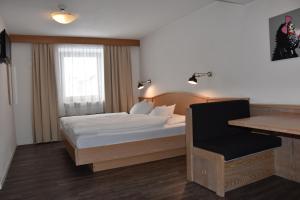Postel nebo postele na pokoji v ubytování Hotel Stocker