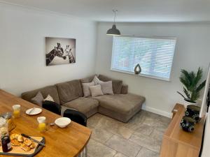 a living room with a couch and a table at Number 15 in Norwich