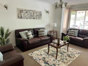 a living room with two couches and a coffee table at Number 15 in Norwich
