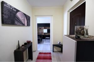 a room with a hallway with a living room at Panorama apartment near Szeged Plaza in Szeged