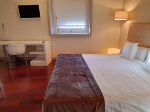 Postel nebo postele na pokoji v ubytování Hotel Ceres