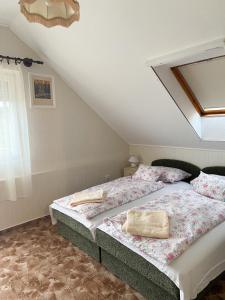 A bed or beds in a room at Piroska Apartment