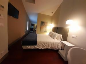 Postel nebo postele na pokoji v ubytování Hotel Ceres