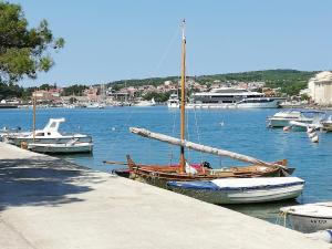 a group of boats are docked in a harbor at Zupan 1 - apartman in Krk