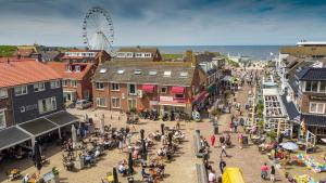 an aerial view of a town with a ferris wheel at Aan Zee en Duin in Egmond aan Zee