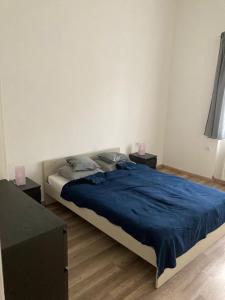 Posteľ alebo postele v izbe v ubytovaní Harmath-Szabó Apartman