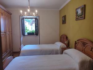 Cama o camas de una habitación en Alojamiento Rural URGAIN I y II