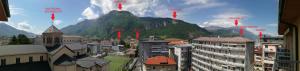 a view of a city with a mountain in the background at Design apartment n. 41 in Trento