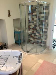 a bathroom with a shower and a sink at Garden apartment in Weston-super-Mare +15 photos